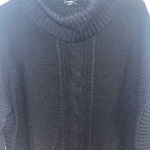 Black turtle neck sweater with slit sides and quarter sleeves